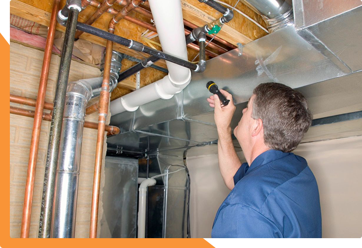 Technician inspecting home's ductwork.